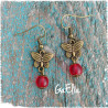 Boucles d'oreilles papillons en métal bronze et perles de verre rouge